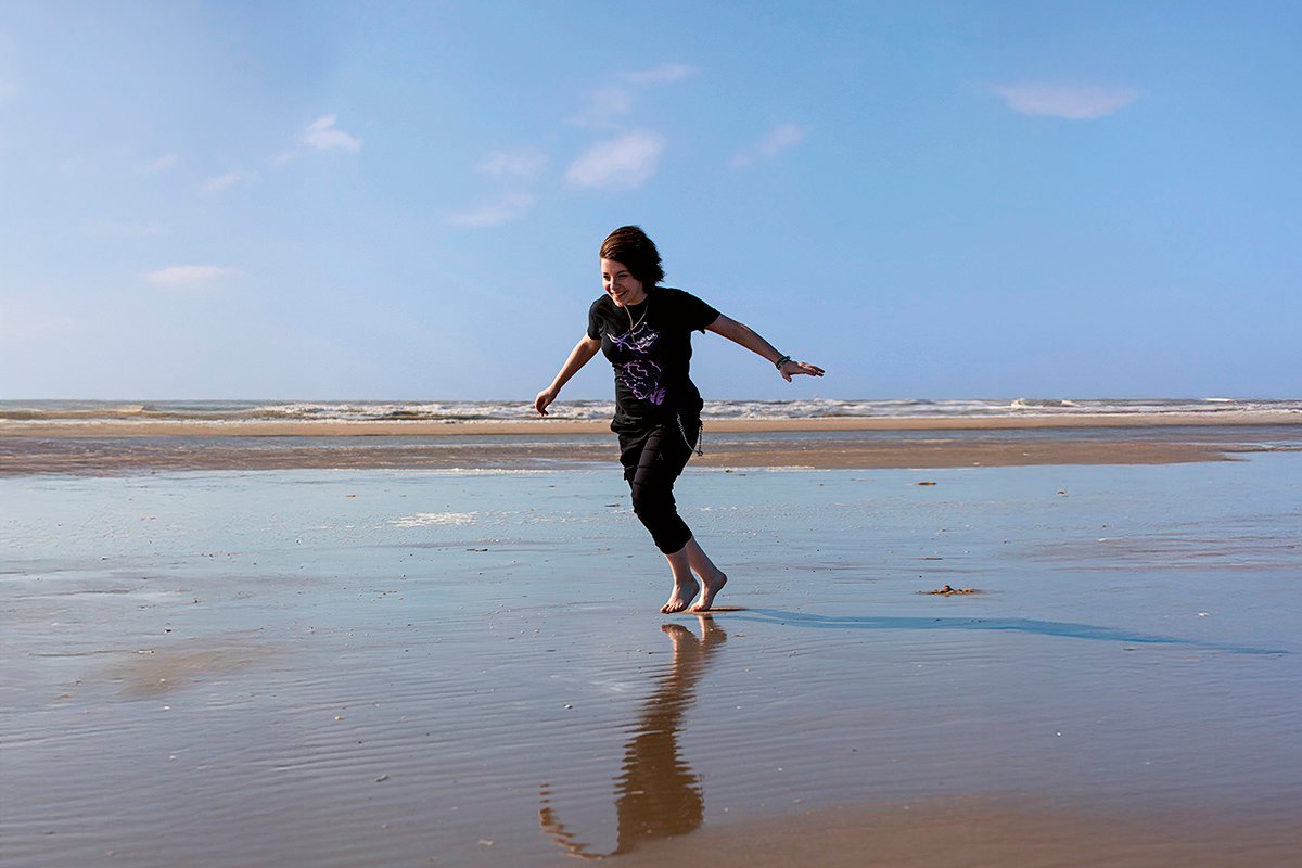 Young girl on a beach representing freedom and bodily autonomy